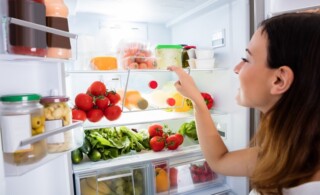 Open fridge filled with fresh foods