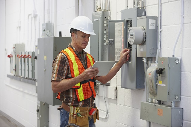Electrician fixing a fuse